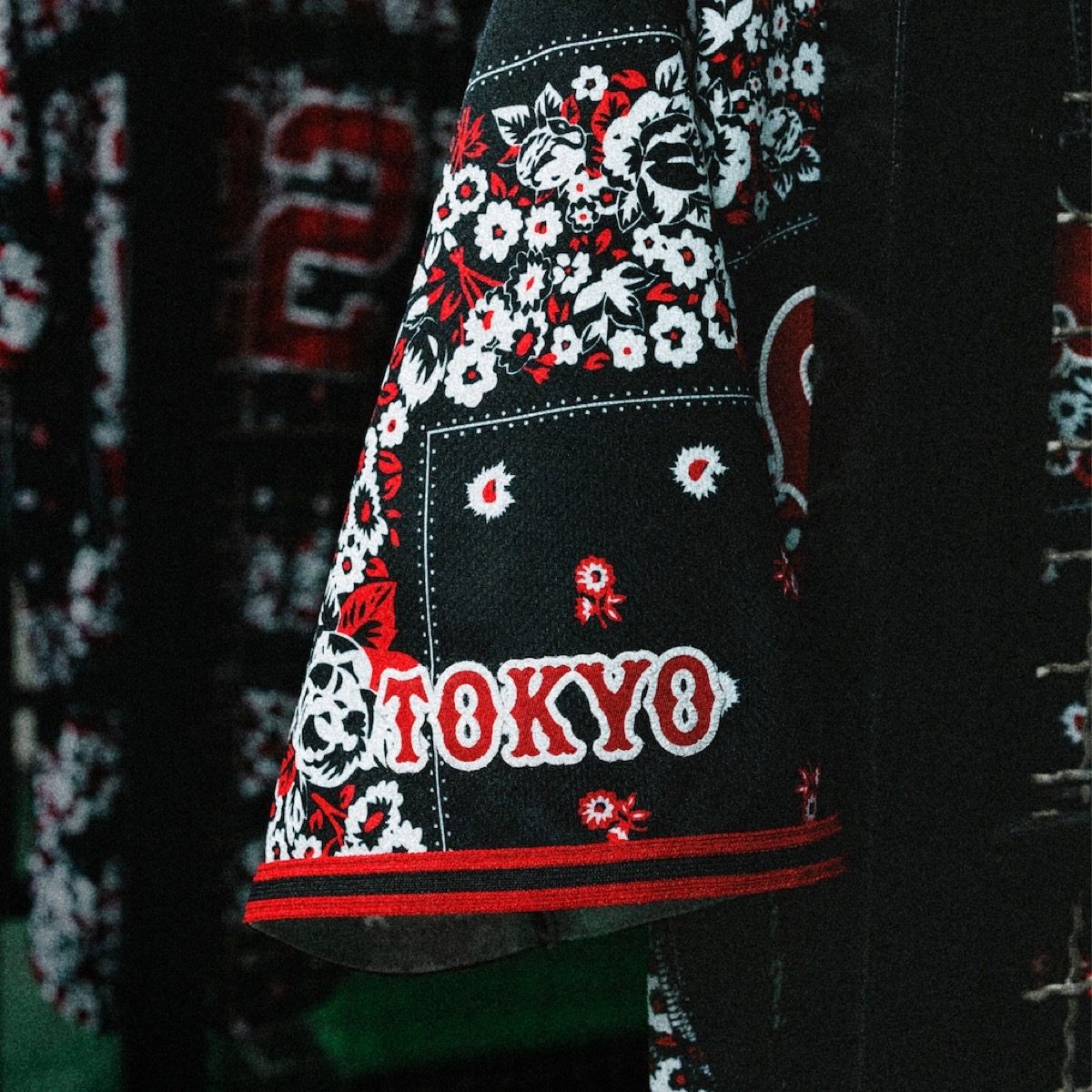 Close-up of TOKYO wordmark and Jumpman on the bandana uniform sleeve
