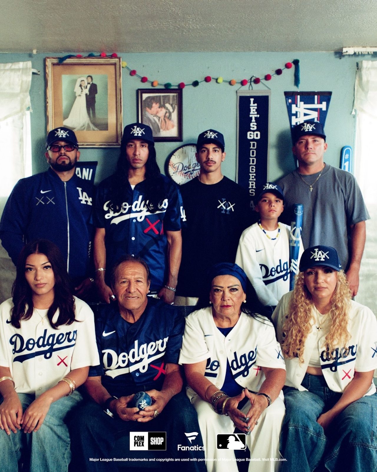 Family wearing KAWS x MLB Dodgers collab items in a lifestyle photo
