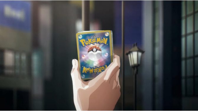 輝くポケモンカードのパックを手にするシーン