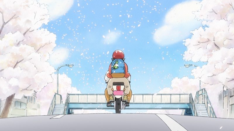 桜の下で自転車に乗るシーン