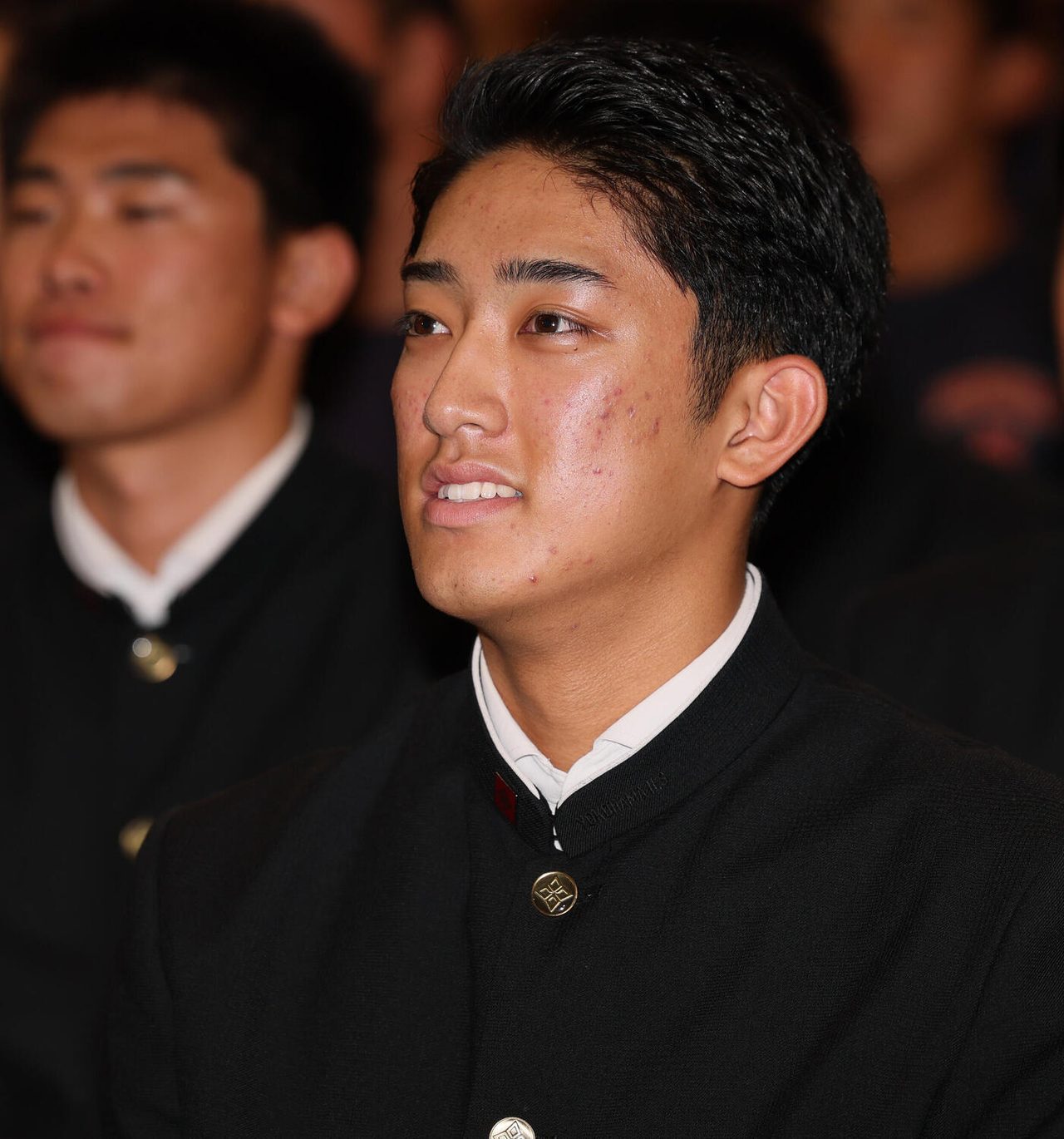 ドラフト会議で巨人の1位指名を受けた織田翔希投手の表情