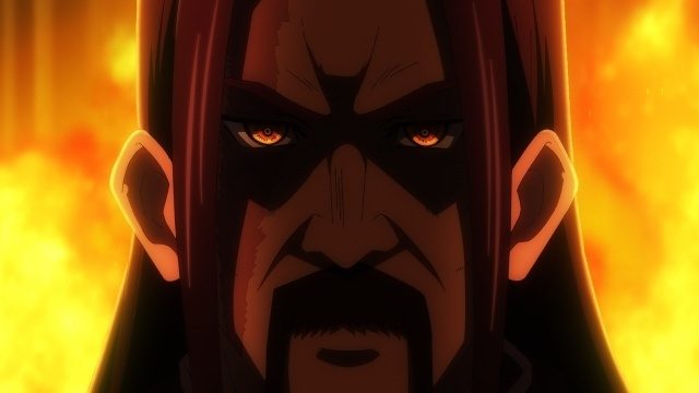 メインPV第2弾の場面カット。炎を背景に鋭い眼光で正面を見据える強敵の顔